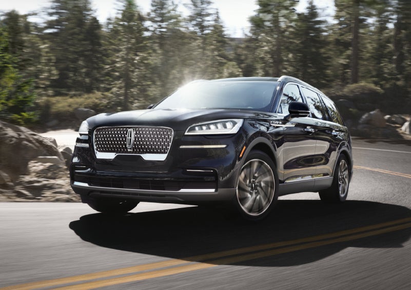 A Lincoln Aviator® SUV is being driven on a winding mountain road | Stivers Lincoln in Waukee IA