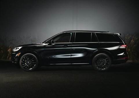 A 2024 Lincoln Aviator® SUV is shown in the Infinite Black exterior color | Stivers Lincoln in Waukee IA