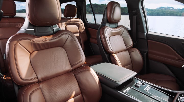 The front row's Perfect Position Seats in a 2024 Lincoln Aviator® Reserve model with Ebony Roast interior | Stivers Lincoln in Waukee IA
