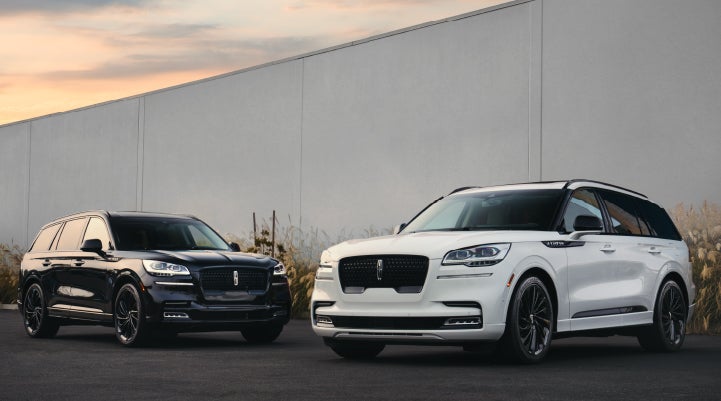 Two Lincoln Aviator® SUVs are shown with the available Jet Appearance Package | Stivers Lincoln in Waukee IA