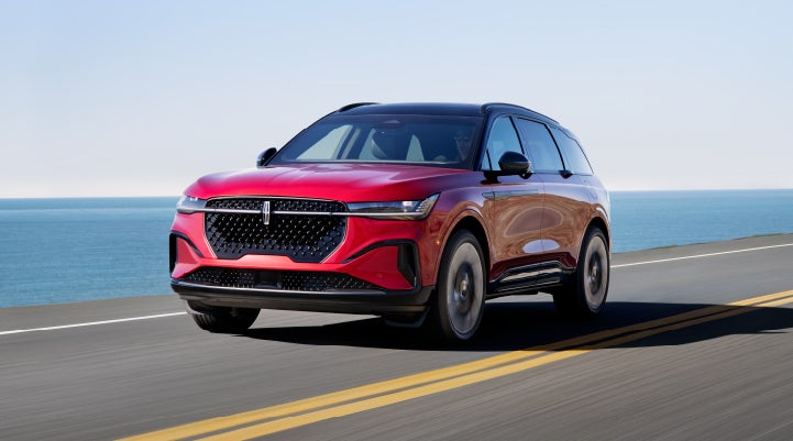 A 2024 Lincoln Nautilus® SUV is being driven on a seaside roadway. | Stivers Lincoln in Waukee IA