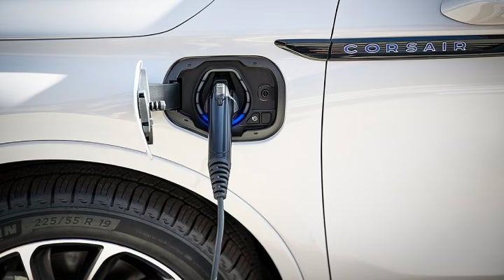 An electric charger is shown plugged into the charging port of a Lincoln Corsair® Grand Touring
model. | Stivers Lincoln in Waukee IA