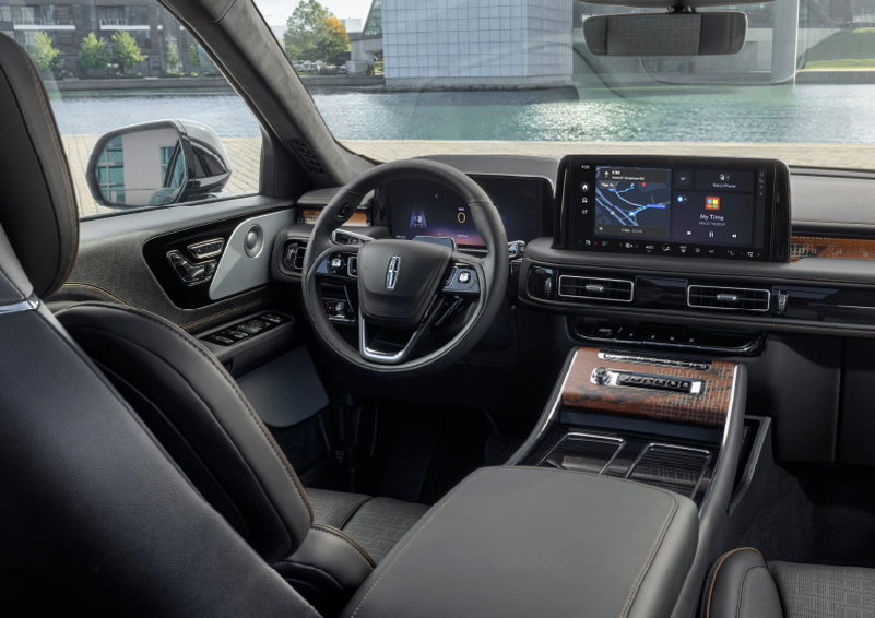 The interior of the 2025 Lincoln Aviator® SUV is shown parked with a view of a harbor through the windshield. | Stivers Lincoln in Waukee IA