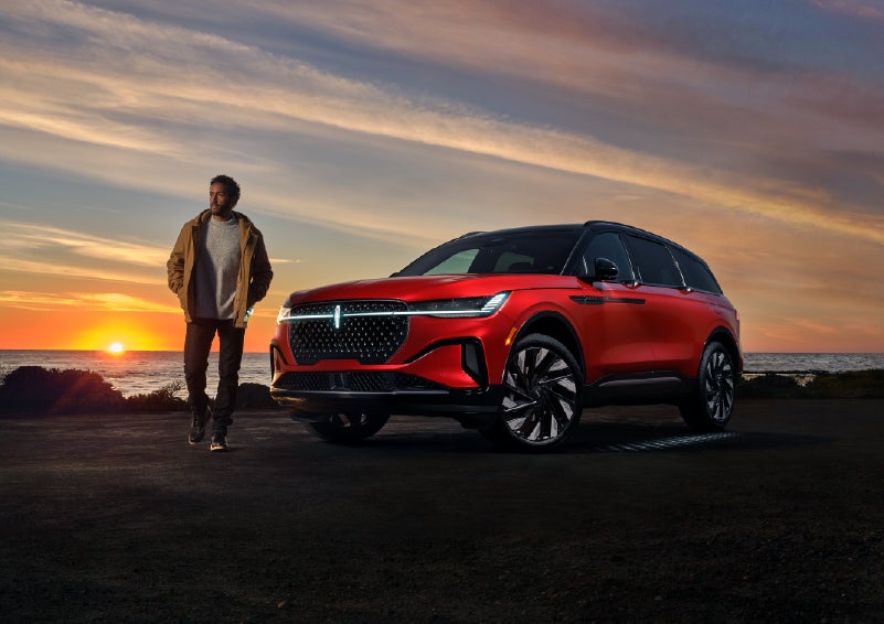 A person is shown next to a 2025 Lincoln Nautilus® SUV as the Lincoln Embrace sequence takes place. | Stivers Lincoln in Waukee IA