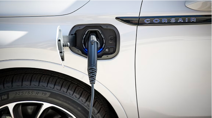An electric charger is shown plugged into the charging port of a Lincoln Corsair® Grand Touring
model. | Stivers Lincoln in Waukee IA