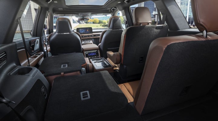 One side of the PowerFold® third-row seat and a second-row seat are folded forward in the 2026 Lincoln Aviator® SUV. | Stivers Lincoln in Waukee IA