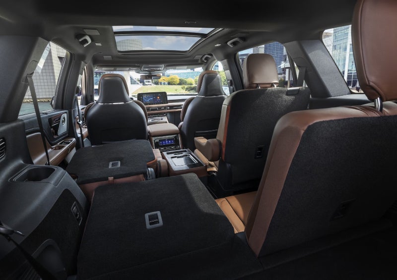 One side of the PowerFold® third-row seat and a second-row seat are folded forward in the 2026 Lincoln Aviator® SUV. | Stivers Lincoln in Waukee IA