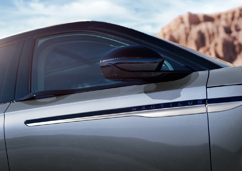 Blue lettering on the side of the vehicle that reads Nautilus indicates the available Hybrid Powertrain. | Stivers Lincoln in Waukee IA