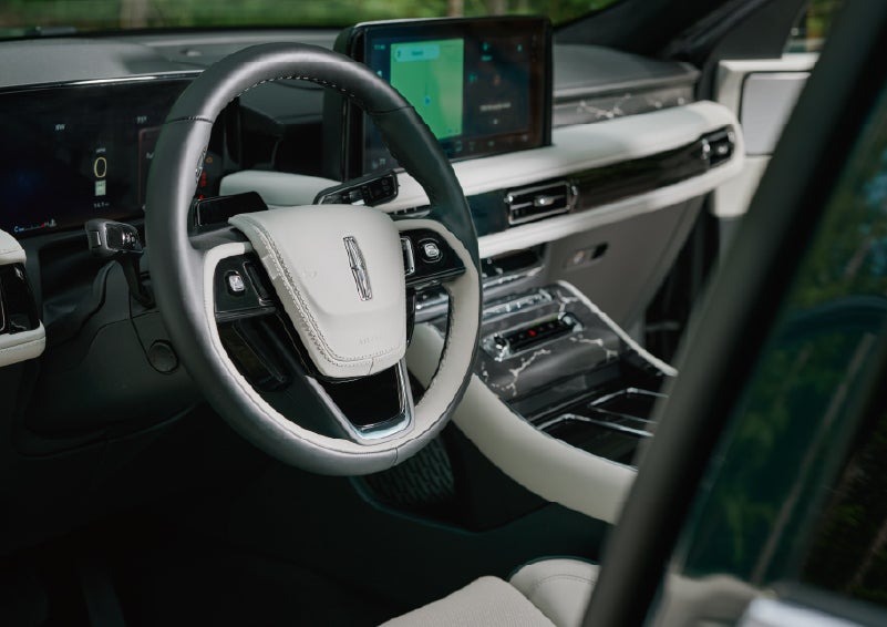 The leather-trimmed steering wheel of a 2027 Lincoln Aviator® Black Label™ SUV. | Stivers Lincoln in Waukee IA